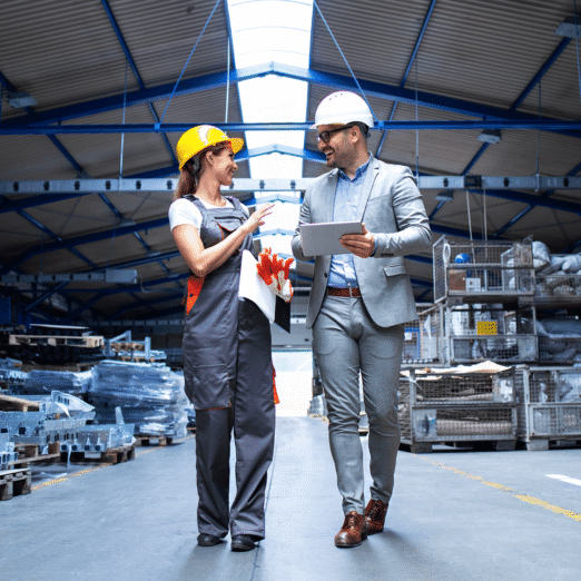 manager-supervisor-industrial-worker-uniform-walking-large-metal-factory-hall-talking-about-increasing-production 1 (2)